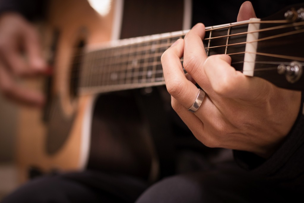 Playing Guitar Christian Stock Photo